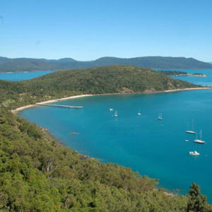 View across the turquoise waters and green hills of Bauer Bay on South Molle Island in the Whitsundays