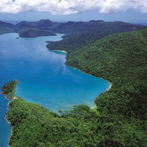 Aerial view over Cid Harbour and the surrounding lush hills of Whitsunday Island