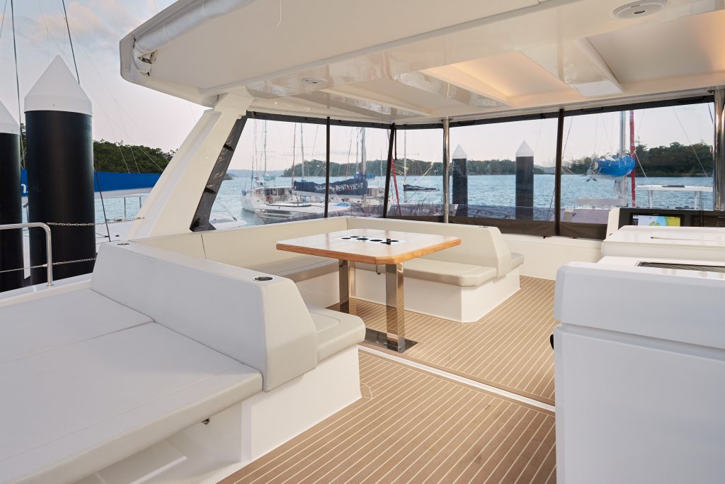 lounge and dining area on flybridge of Leopard 46 Power Catamaran